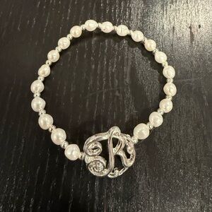 Bansri Silver and Pearl “R” bracelet